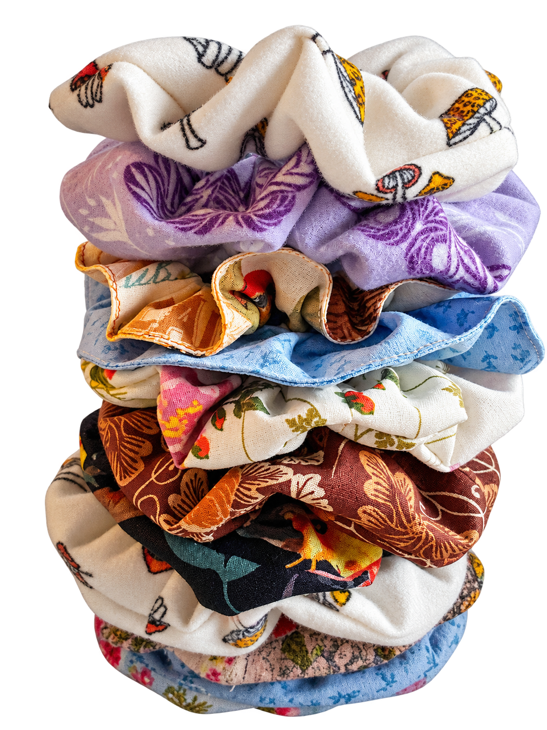 A colorful stack of handmade fabric hair scrunchies